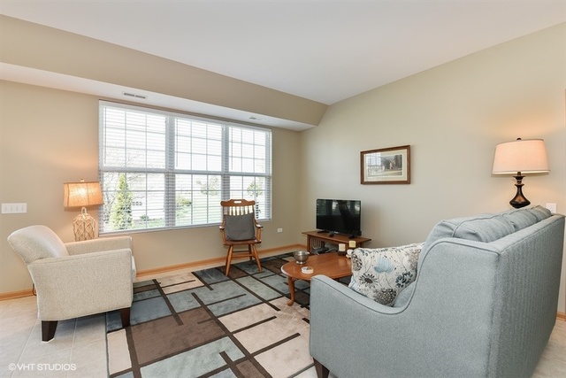 13509 Delaney Road Huntley, IL 60142 - Photo 3 of 15 a living room with furniture and a window