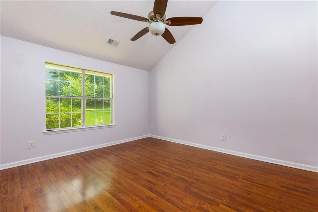 552 Casey's Crossing Winder, GA 30680 - Photo 12 of 26 wooden floor in an empty room with a window