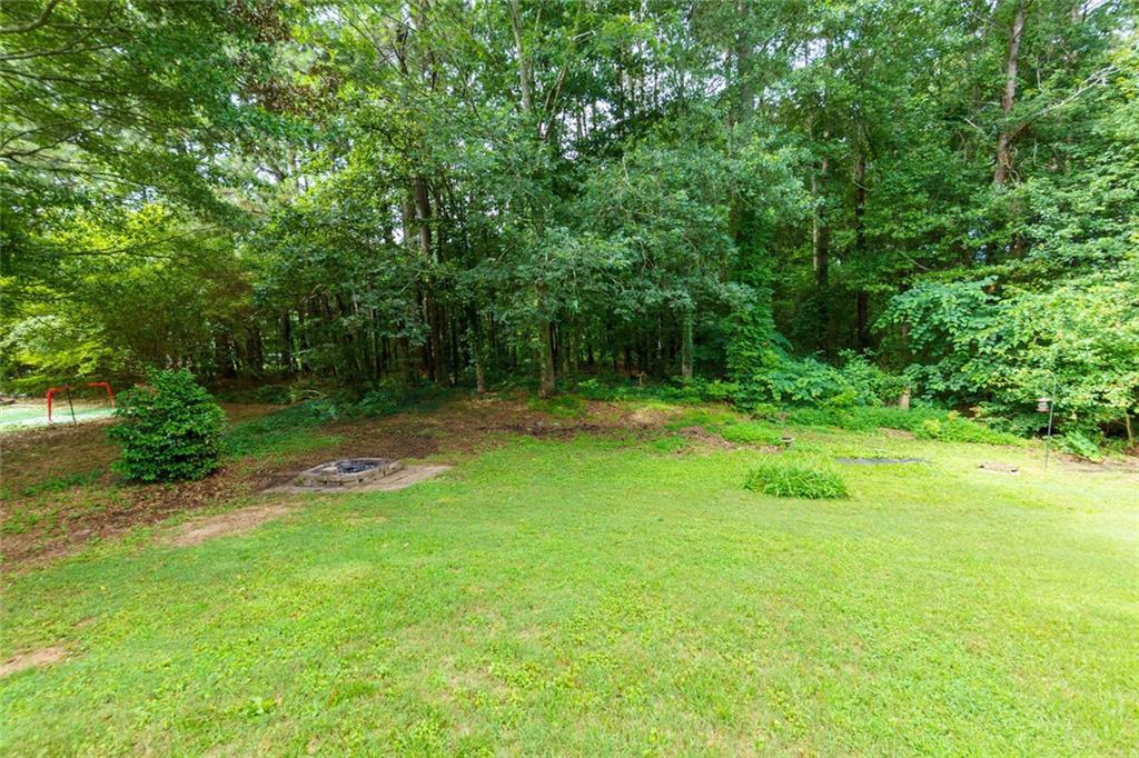 552 Casey's Crossing Winder, GA 30680 - Photo 17 of 26 a view of a park with a tree in the background