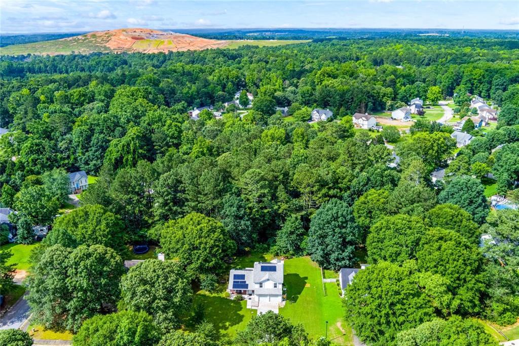 552 Casey's Crossing Winder, GA 30680 - Photo 20 of 26 a view of a big yard with plants and large trees