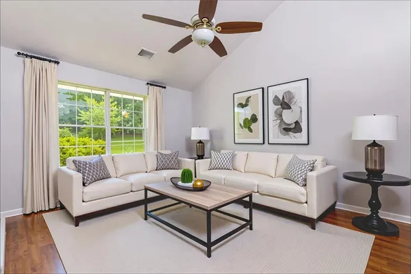 a living room with furniture and a large window