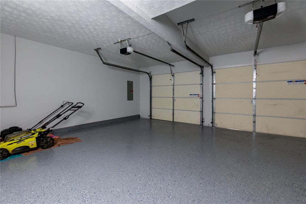 552 Casey's Crossing Winder, GA 30680 - Photo 22 of 26 a view of a room with gym equipment