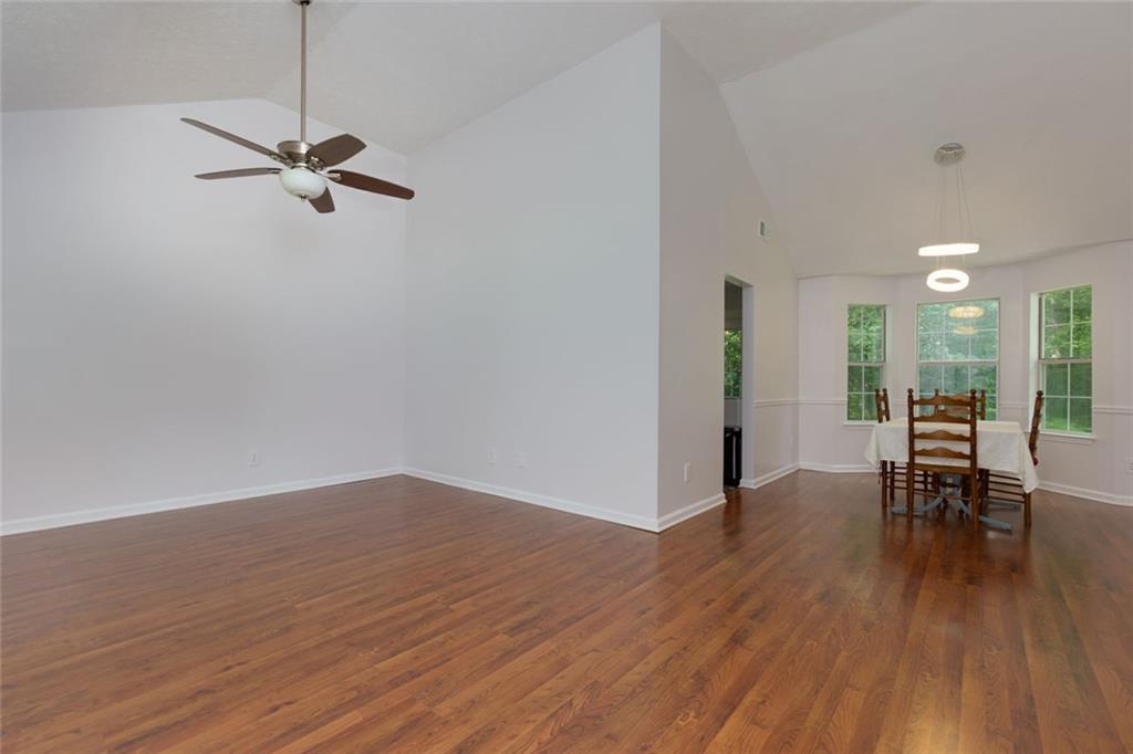552 Casey's Crossing Winder, GA 30680 - Photo 4 of 26 a view of a room with wooden floor and furniture