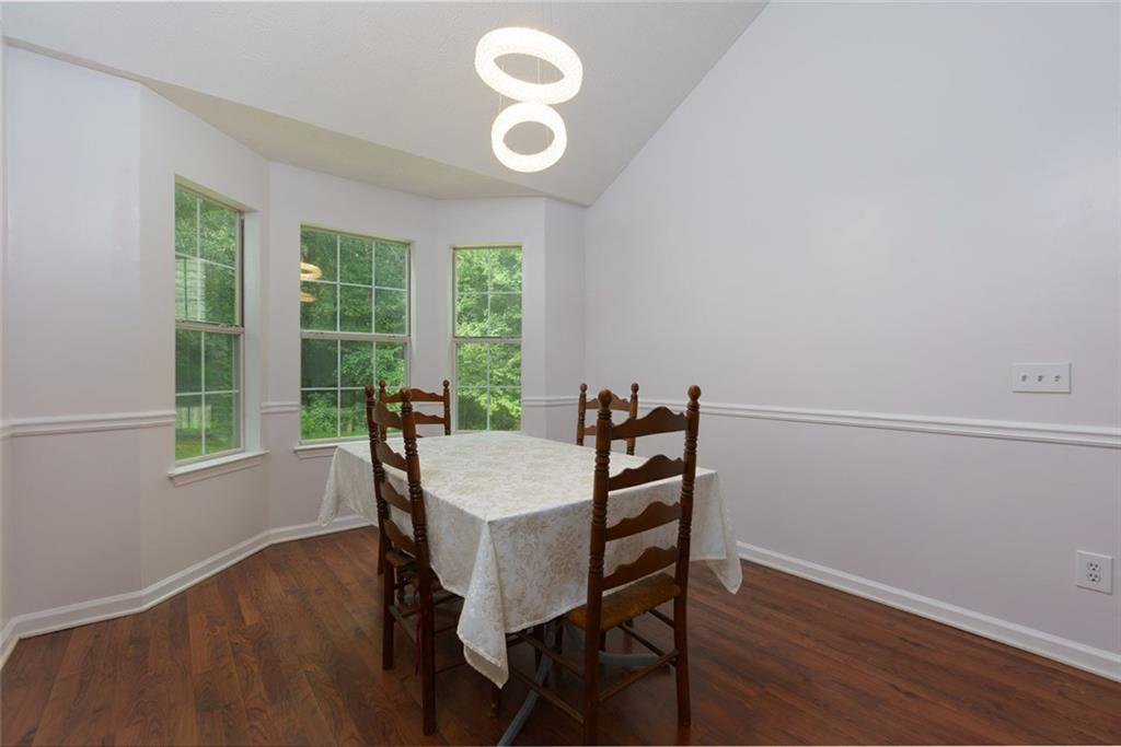 552 Casey's Crossing Winder, GA 30680 - Photo 5 of 26 a view of a dining room with furniture window and outside view