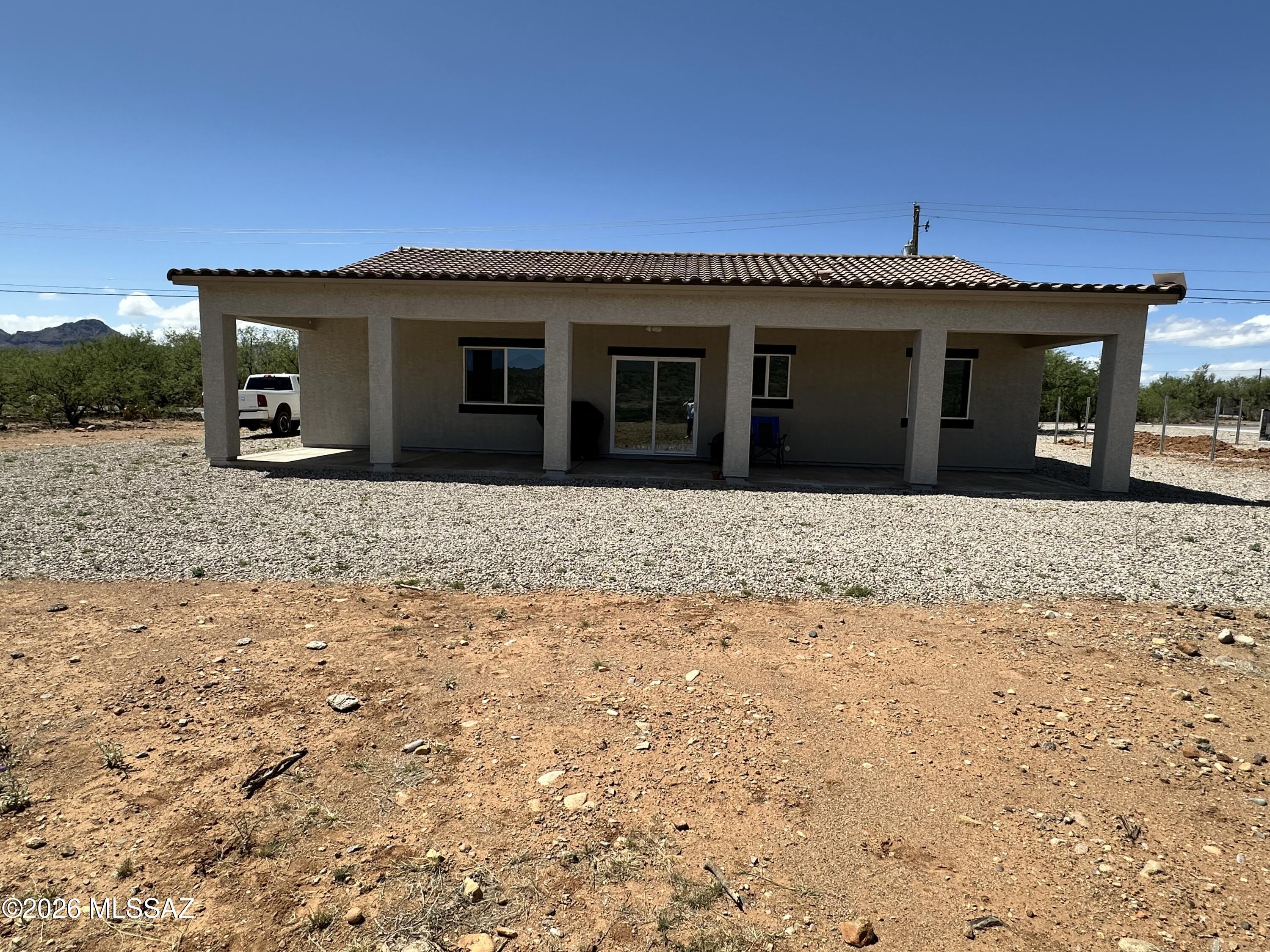 117 Ver Patria Rio Rico, AZ 85648 - Photo 25 of 28 a front view of a house with a yard