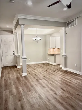 a view of a room with wooden floor and floors