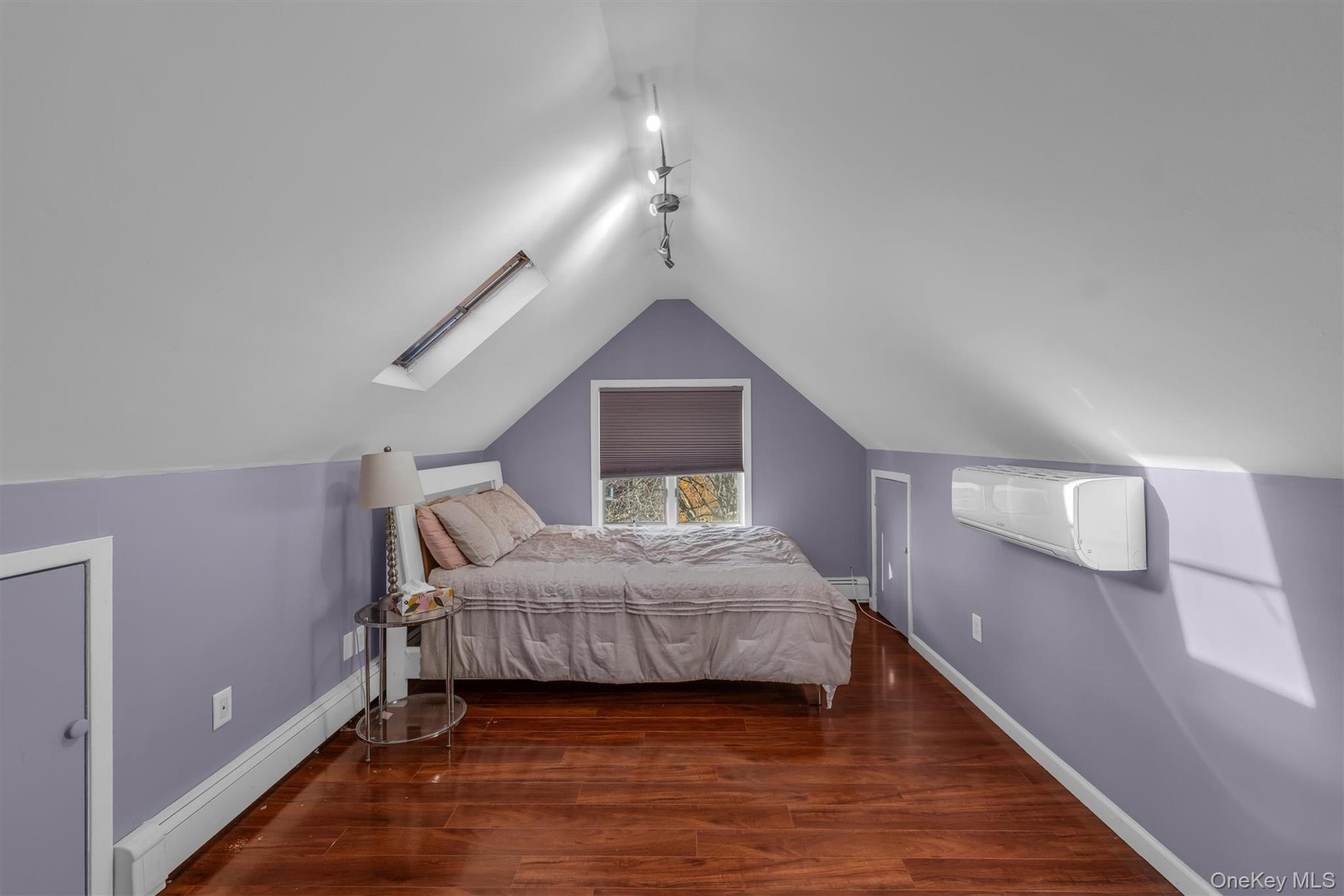 95 Liberty Boulevard Valley Stream, NY 11580 - Photo 12 of 17 a bedroom with a large bed and a window