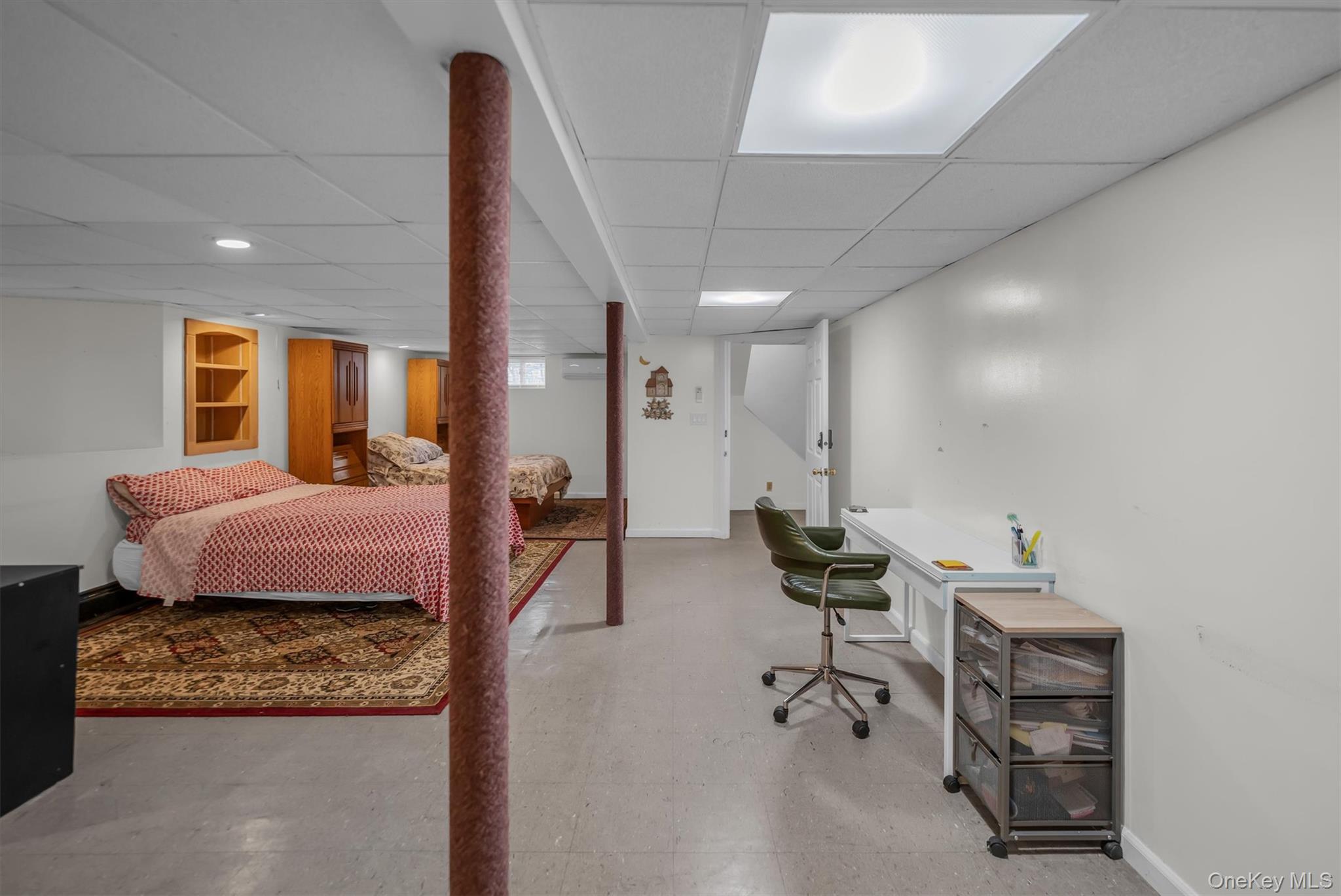 95 Liberty Boulevard Valley Stream, NY 11580 - Photo 14 of 17 a bedroom with furniture and wooden floor