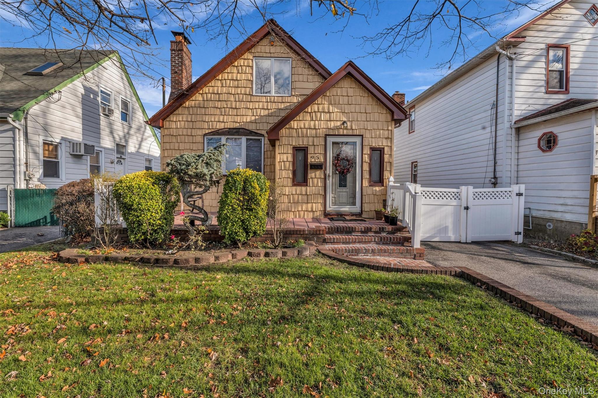 95 Liberty Boulevard Valley Stream, NY 11580 - Photo 2 of 17 a view of a house with backyard and sitting area