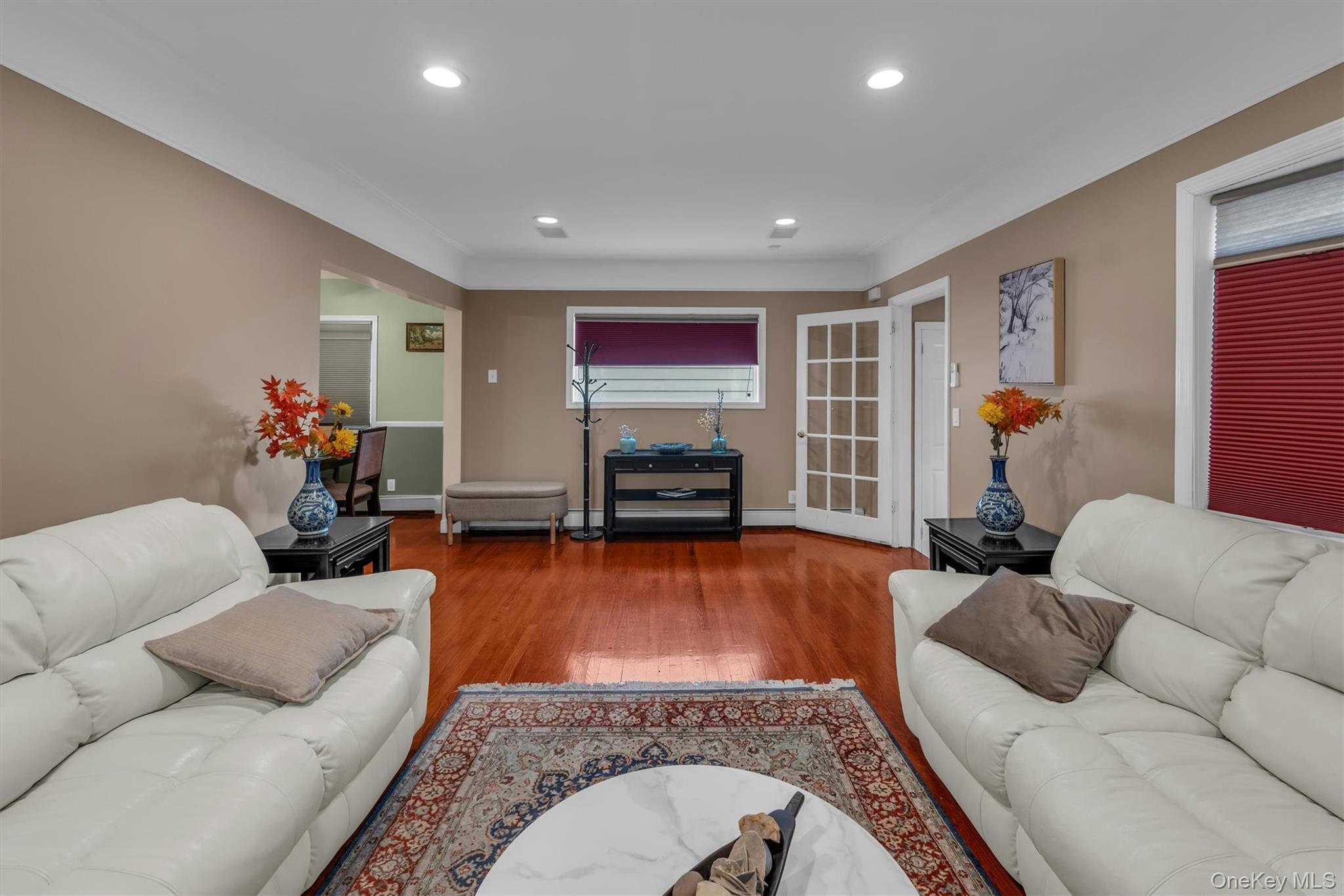 95 Liberty Boulevard Valley Stream, NY 11580 - Photo 4 of 17 a living room with furniture and a flat screen tv