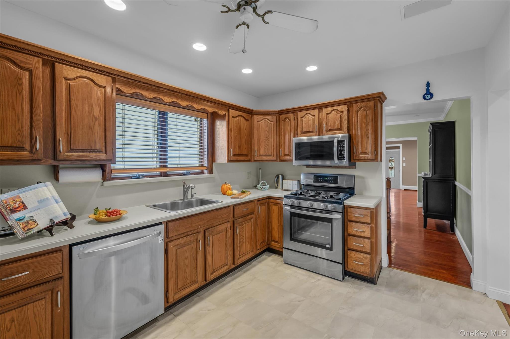 95 Liberty Boulevard Valley Stream, NY 11580 - Photo 6 of 17 a kitchen with stainless steel appliances granite countertop a stove sink and cabinets