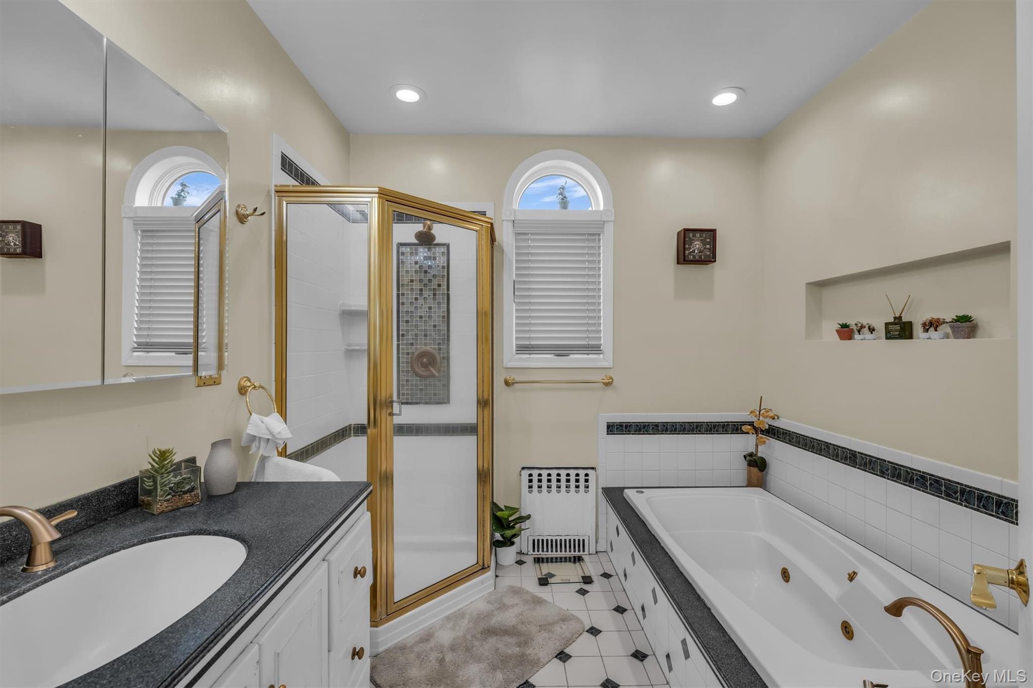 95 Liberty Boulevard Valley Stream, NY 11580 - Photo 7 of 17 a bathroom with a tub sink and mirror