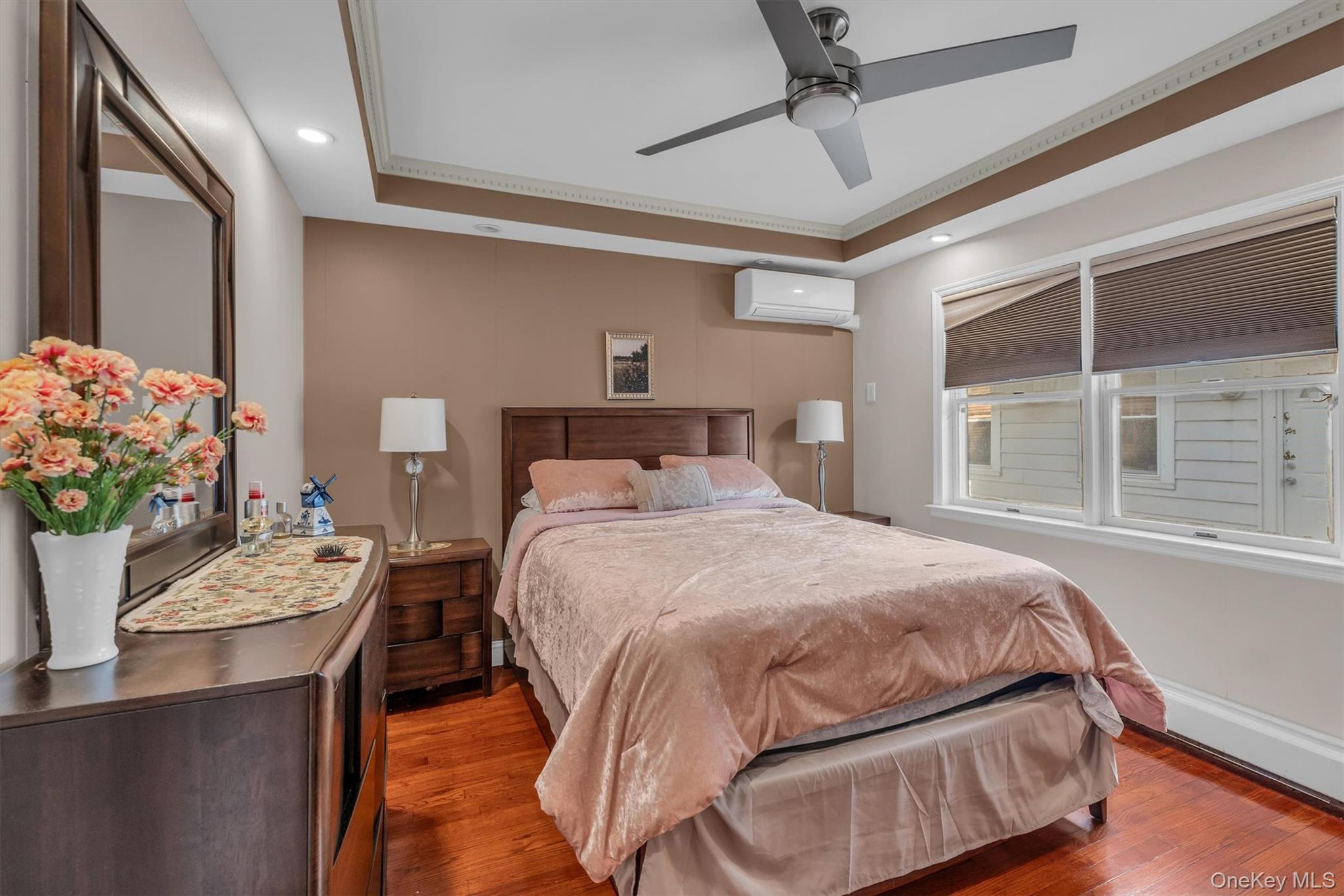 95 Liberty Boulevard Valley Stream, NY 11580 - Photo 8 of 17 a bedroom with a bed and window