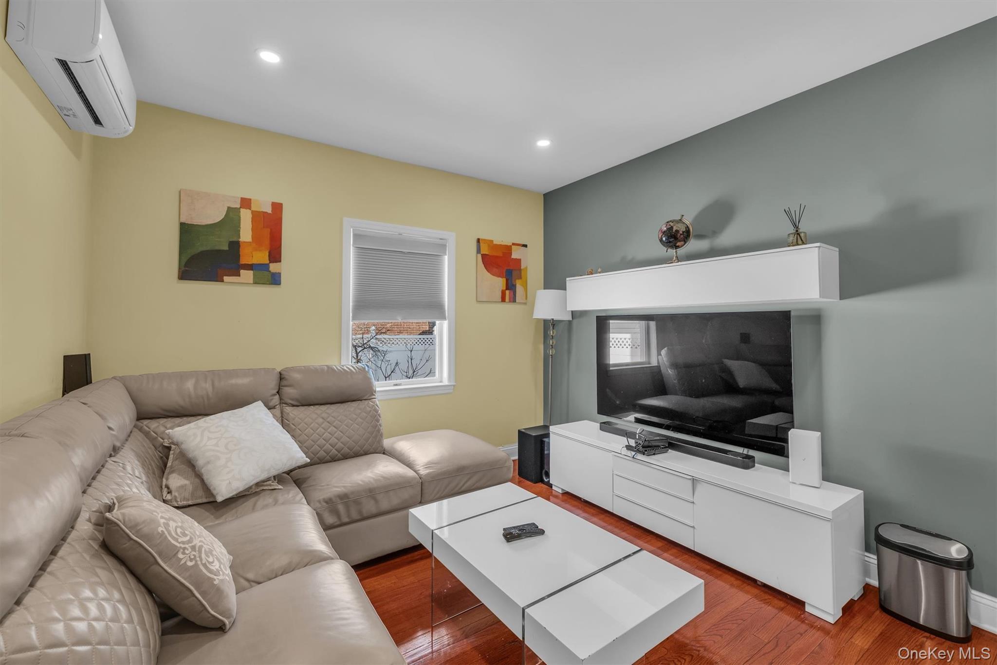 95 Liberty Boulevard Valley Stream, NY 11580 - Photo 9 of 17 a living room with furniture and a flat screen tv