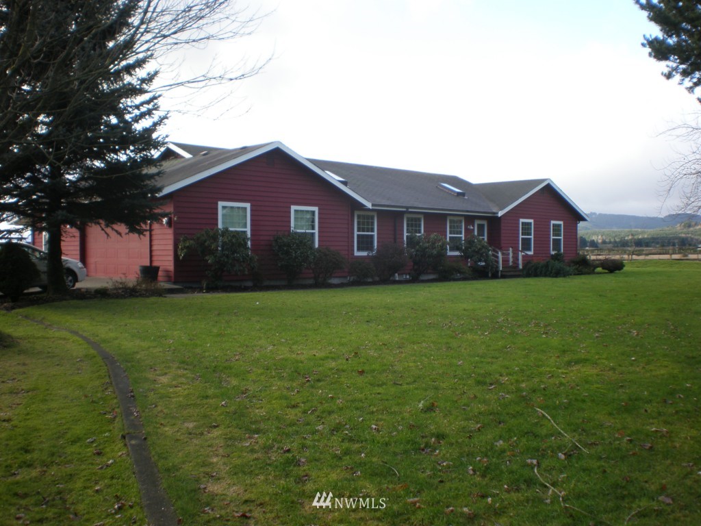 7715 Bordeaux Road Southwest Olympia, WA 98512 - Photo 1 of 1 a front view of house with yard and green space