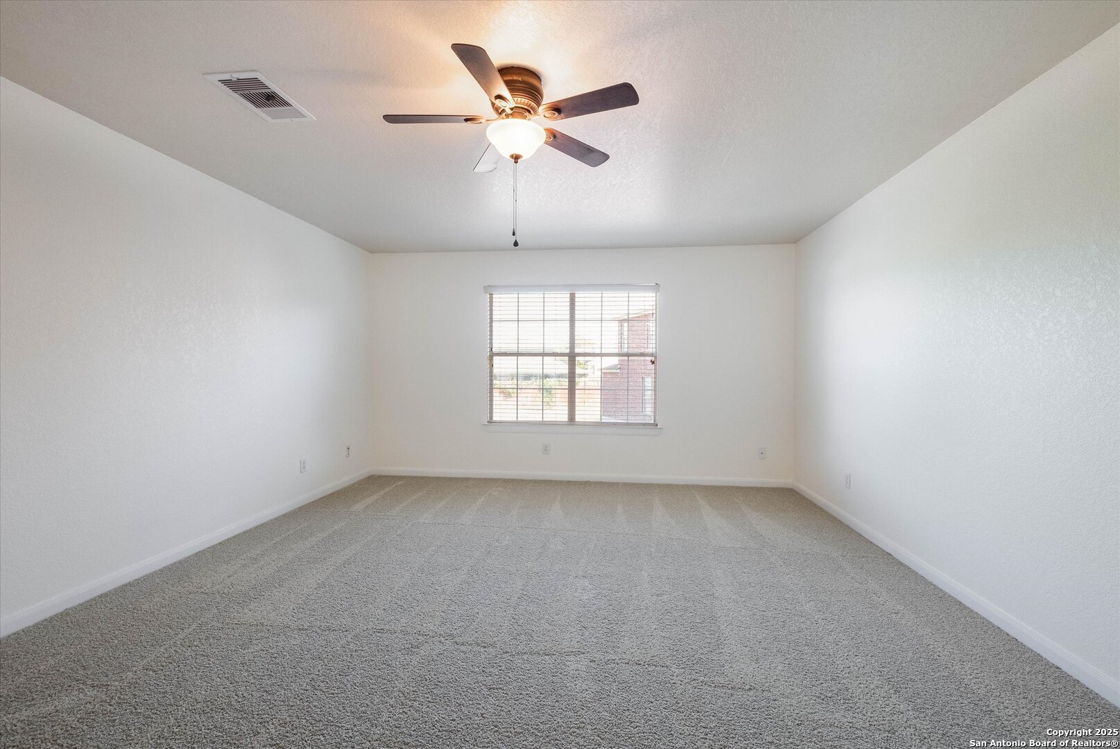 173 Springtree Gate Cibolo, TX 78108 - Photo 15 of 23 wooden floor in an empty room with a window