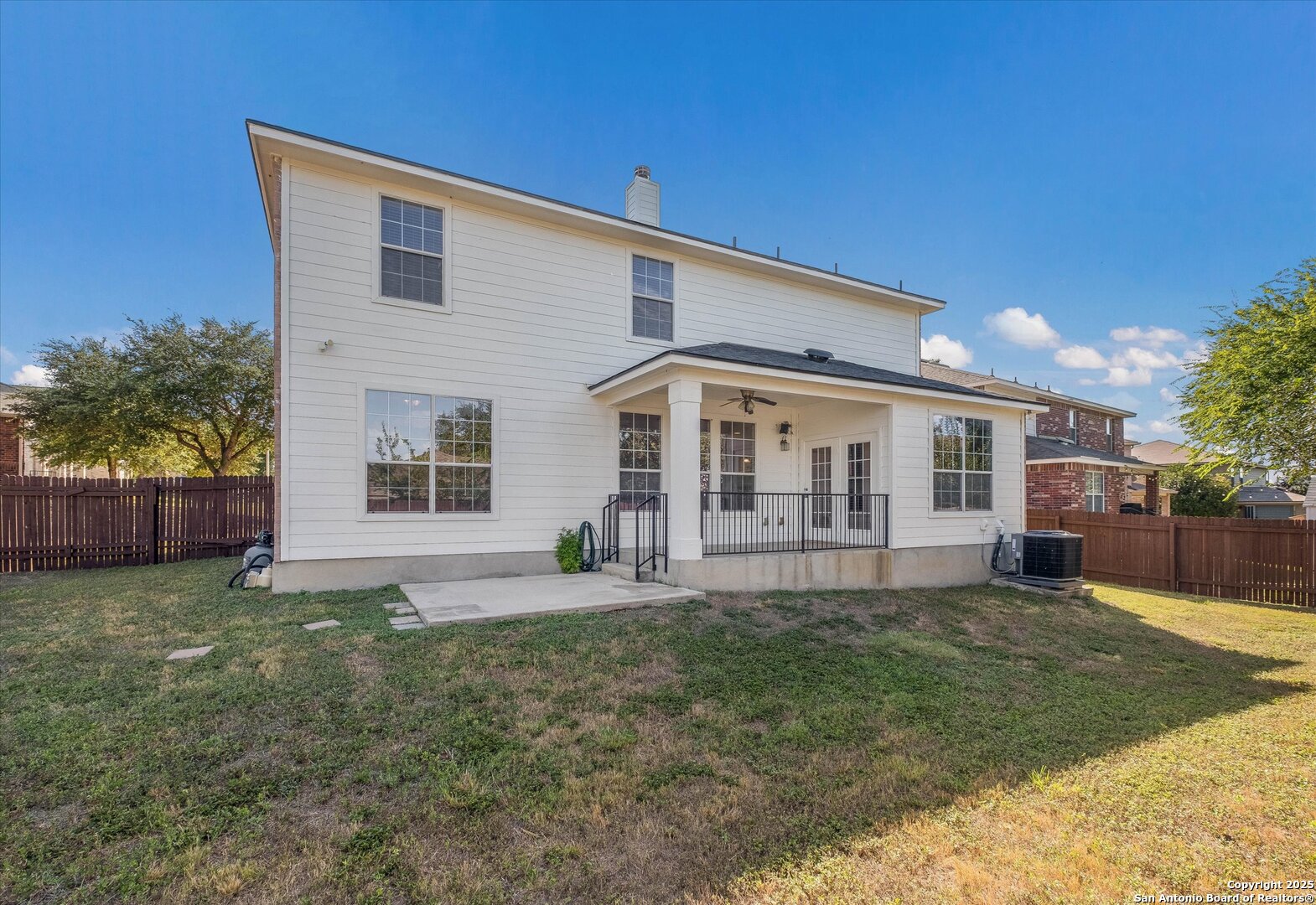 173 Springtree Gate Cibolo, TX 78108 - Photo 21 of 23 a front view of a house with a yard and porch