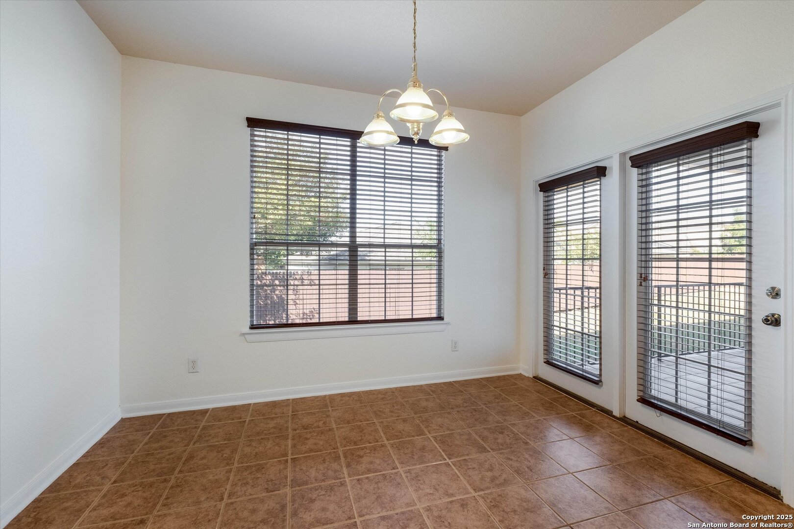 173 Springtree Gate Cibolo, TX 78108 - Photo 9 of 23 a view of an empty room with glass door