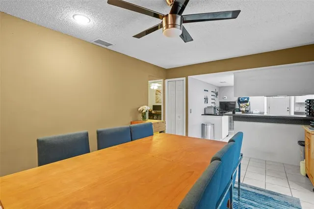 a bed room with a bed and kitchen view