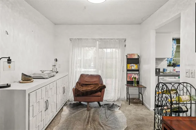 a bedroom with furniture and a window