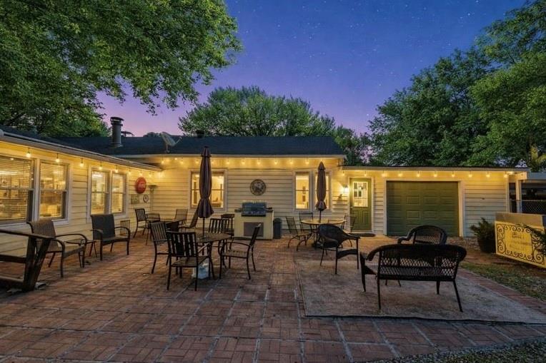 1505 Bonham Street Commerce, TX 75428 - Photo 31 of 38 outdoor cooking area. Includes a detached grill and sink that can remain with the home