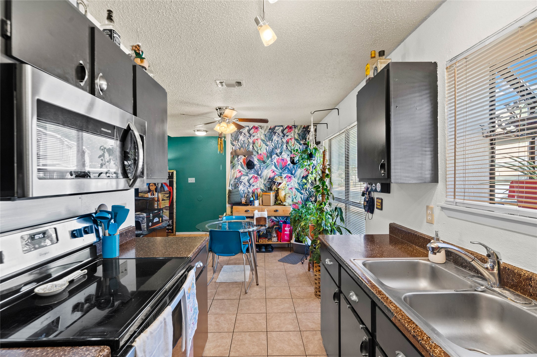 2018 West Rundberg Lane, Unit 4B Austin, TX 78758 - Photo 3 of 28 a kitchen with stainless steel appliances granite countertop a sink stove and refrigerator