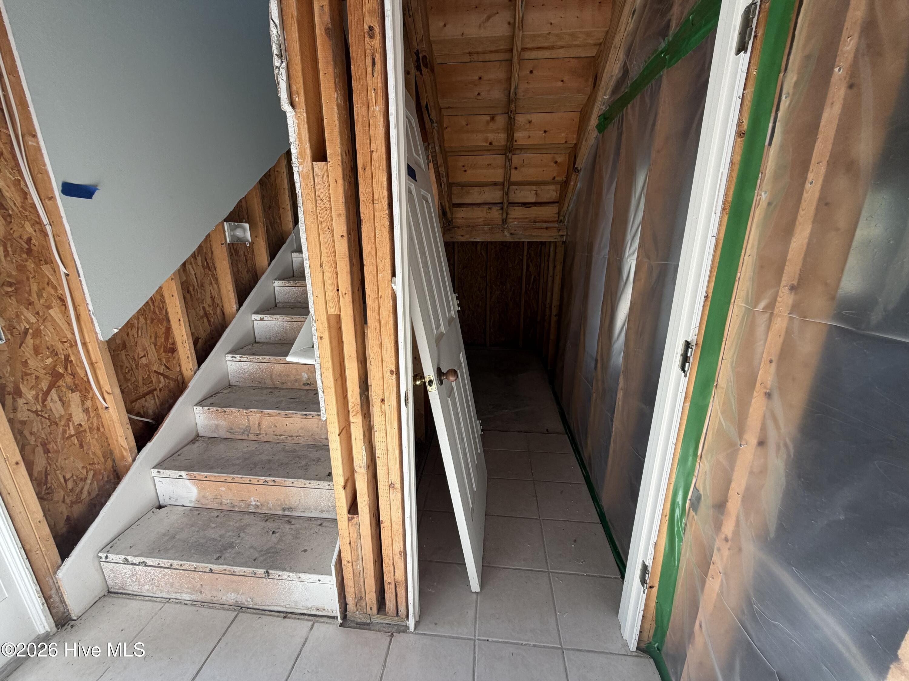 116 Rice Mill Circle, Unit 4 Sunset Beach, NC 28468 - Photo 26 of 29 Ground floor entrance. Storage area goes all the way under steps- lots of room.