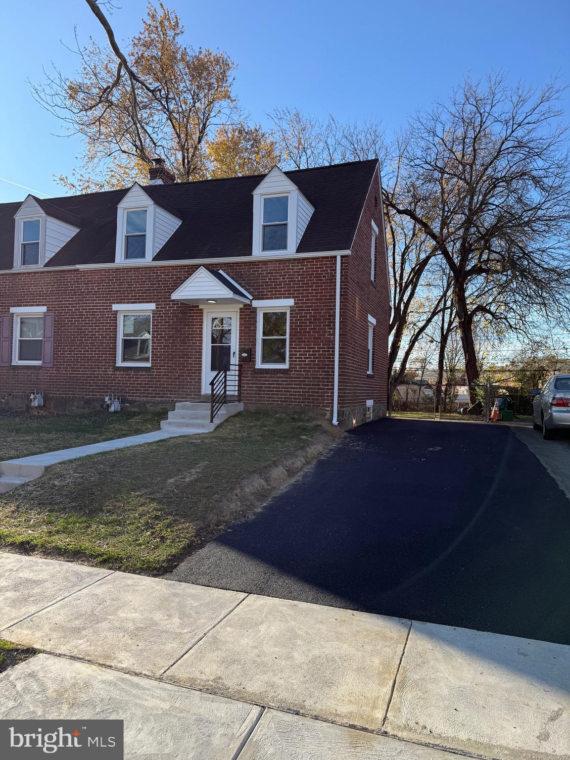 723 Parklane Road Swarthmore, PA 19081 - Photo 1 of 11 a front view of a house with a yard