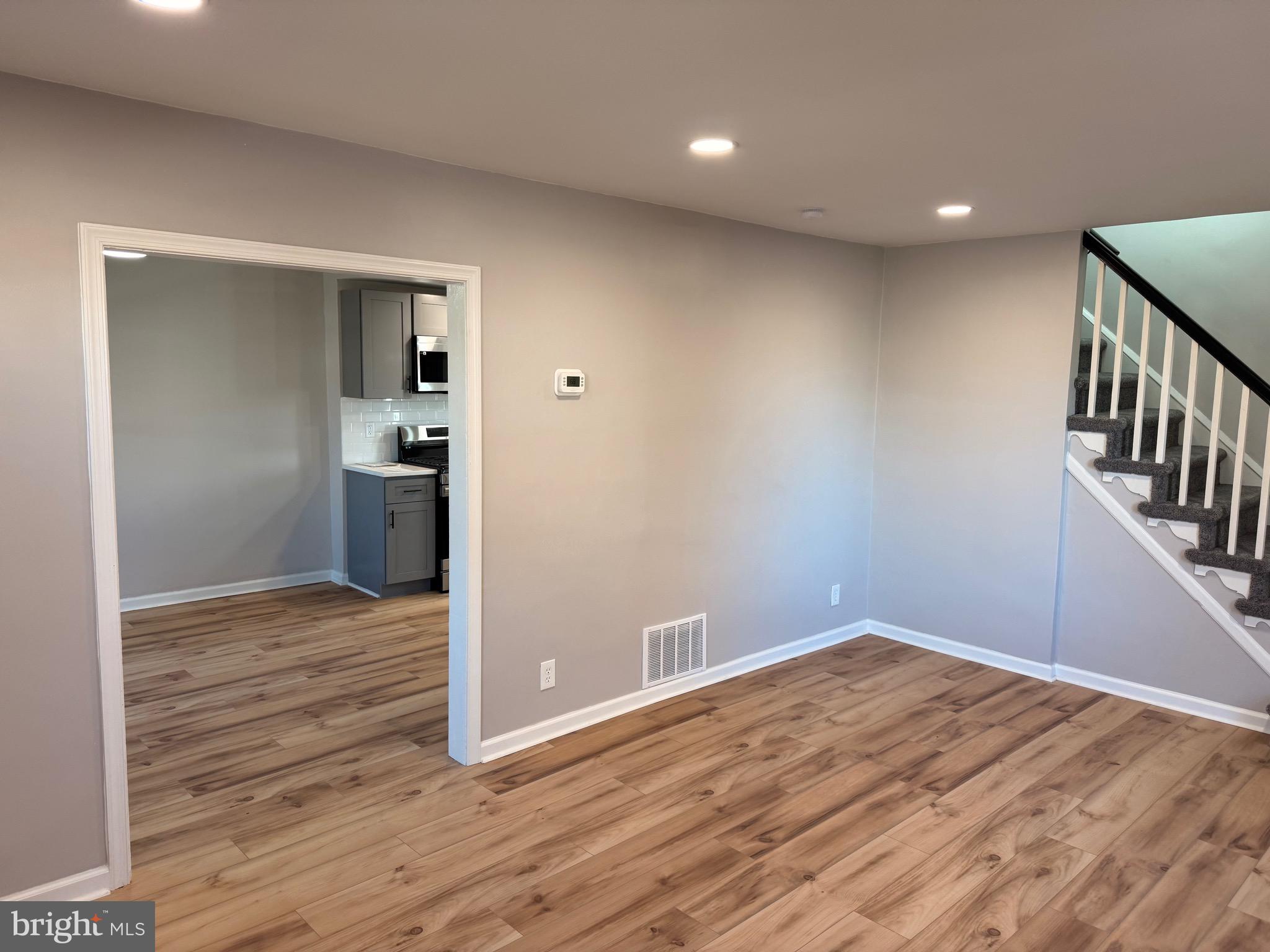 723 Parklane Road Swarthmore, PA 19081 - Photo 2 of 11 a view of hallway with wooden floor