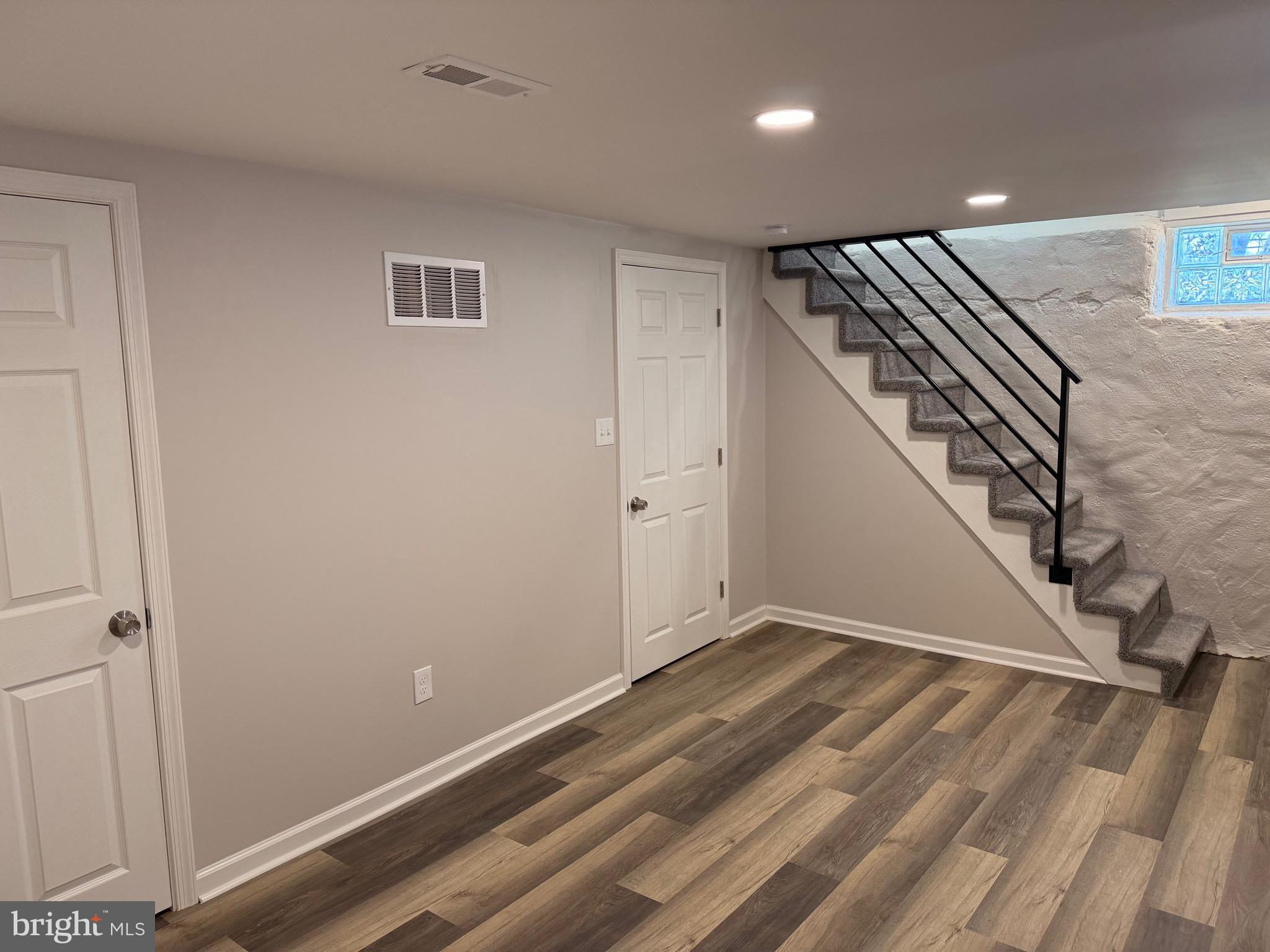 723 Parklane Road Swarthmore, PA 19081 - Photo 8 of 11 a view of an empty room with wooden floor