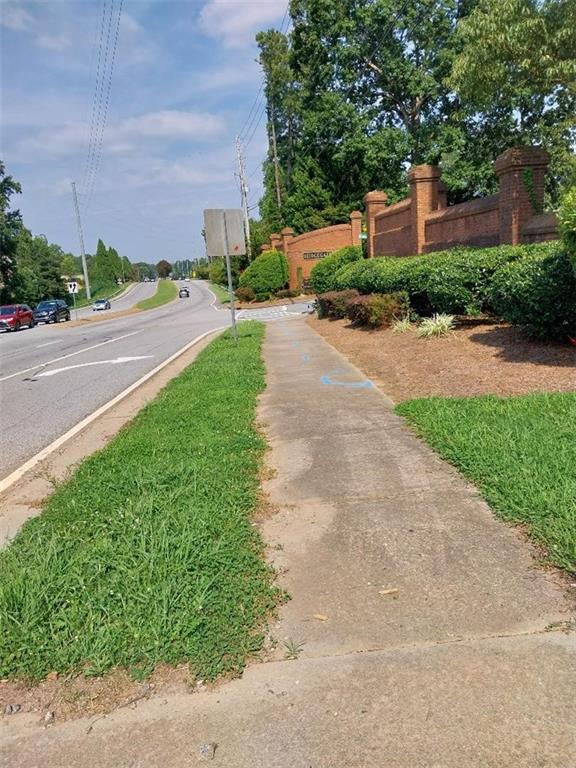 2672 Roswell Road Marietta, GA 30062 - Photo 1 of 17 a street with a building and trees in the background