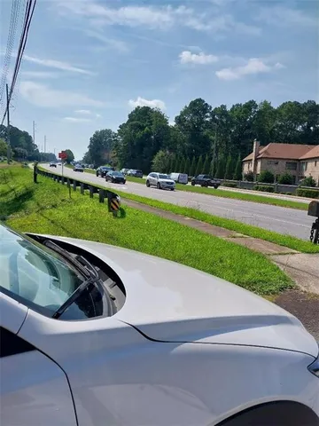 a view of a swimming pool and a yard