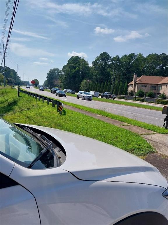 2672 Roswell Road Marietta, GA 30062 - Photo 5 of 17 a view of a swimming pool and a yard