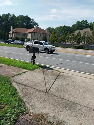 a view of street with parked cars