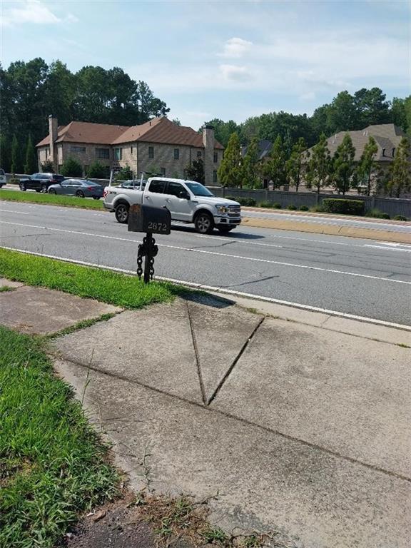 2672 Roswell Road Marietta, GA 30062 - Photo 7 of 17 a view of street with parked cars