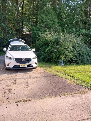 a car parked in the middle of a field