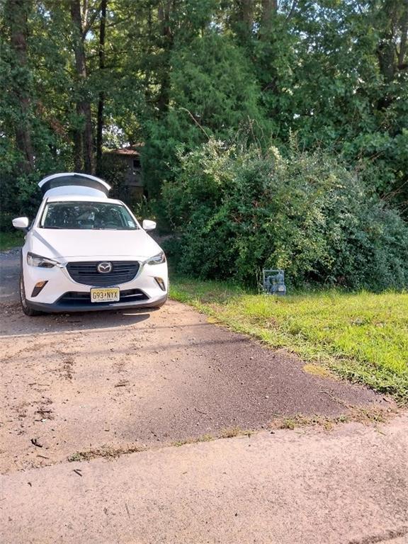 2672 Roswell Road Marietta, GA 30062 - Photo 10 of 17 a car parked in the middle of a field