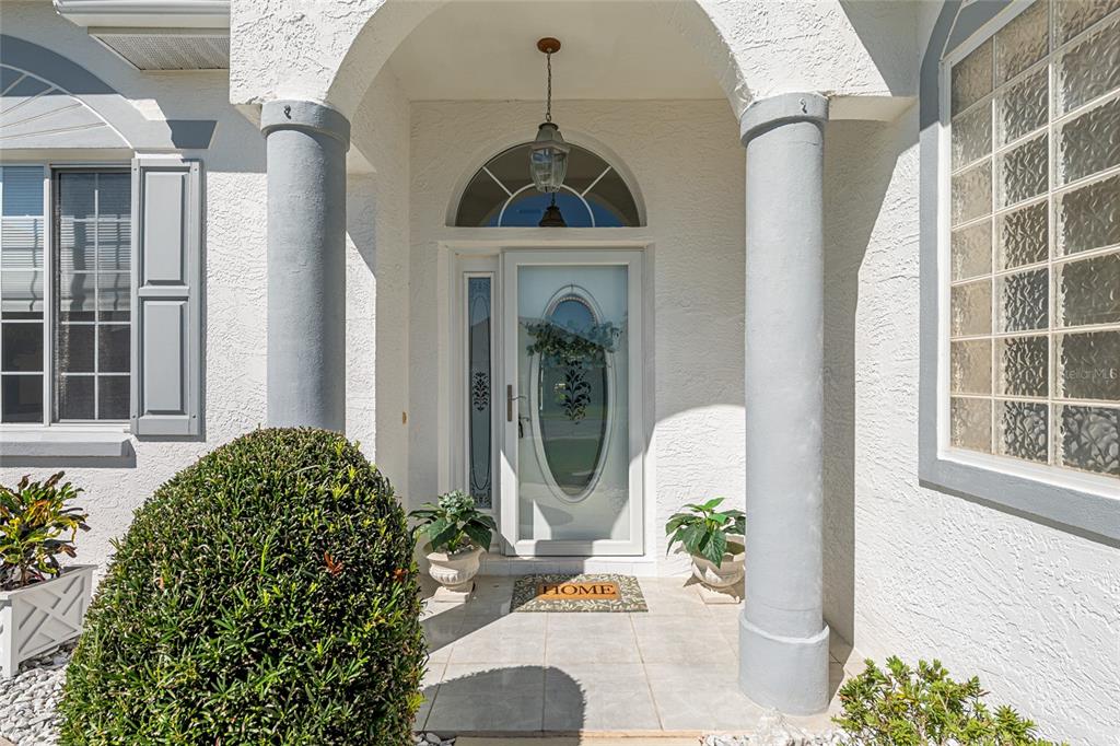 5711 Northwest 25th Loop Ocala, FL 34482 - Photo 11 of 91 a front view of a house with a garden