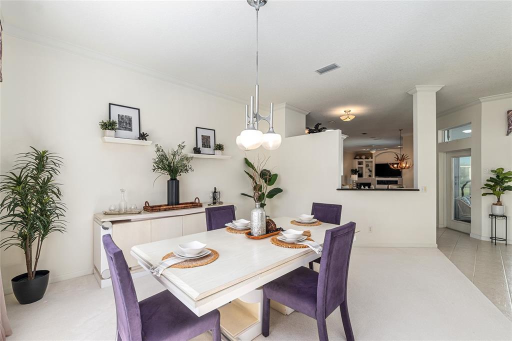 5711 Northwest 25th Loop Ocala, FL 34482 - Photo 18 of 91 a dining room with furniture and window