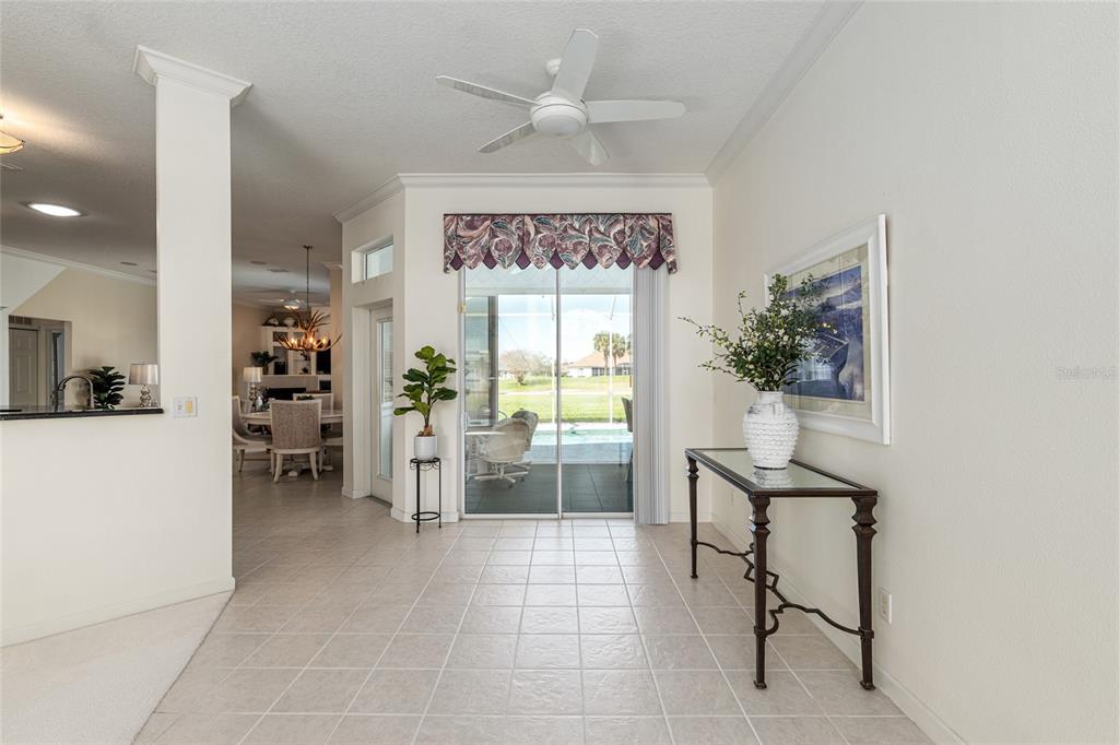 5711 Northwest 25th Loop Ocala, FL 34482 - Photo 19 of 91 a living room with furniture a window and a chandelier