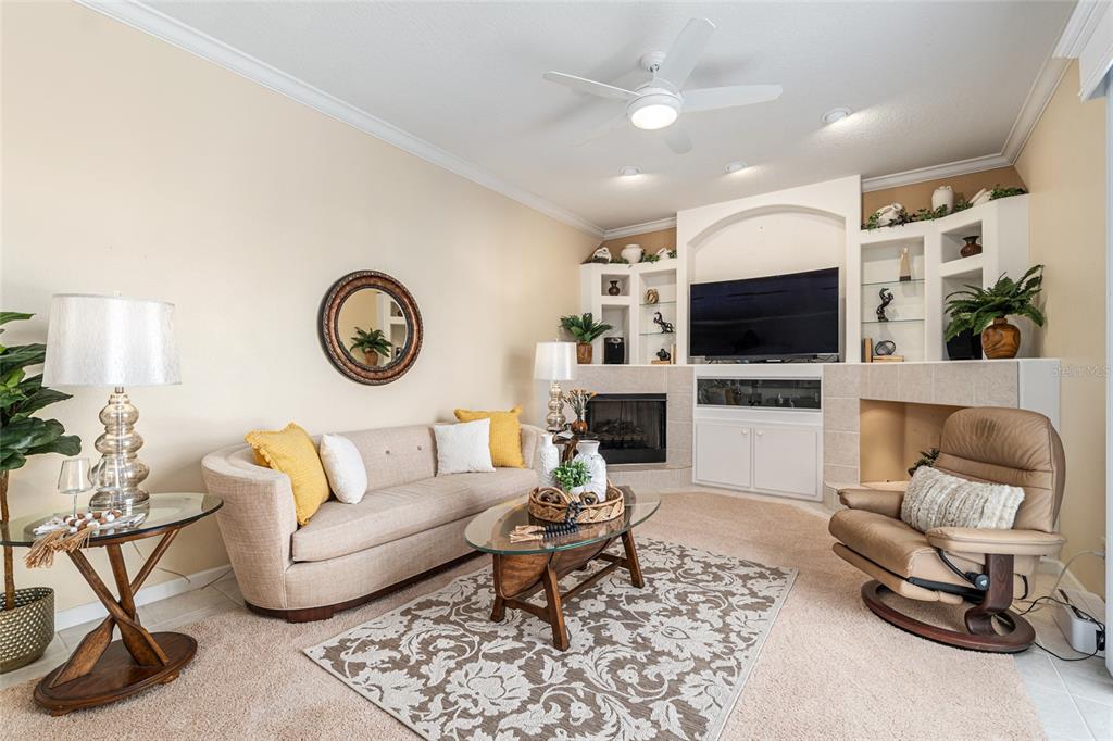 5711 Northwest 25th Loop Ocala, FL 34482 - Photo 24 of 91 a living room with furniture and a flat screen tv