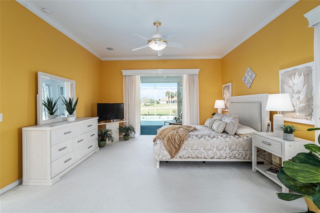 5711 Northwest 25th Loop Ocala, FL 34482 - Photo 40 of 91 a spacious bedroom with a bed and a dresser