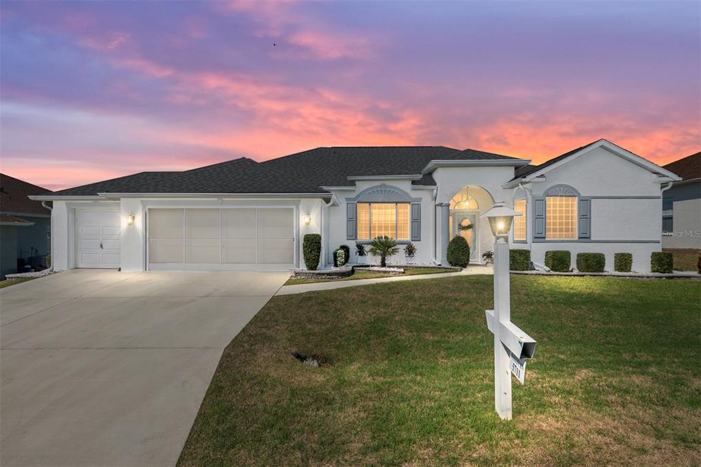 5711 Northwest 25th Loop Ocala, FL 34482 - Photo 5 of 91 a front view of a house with a yard