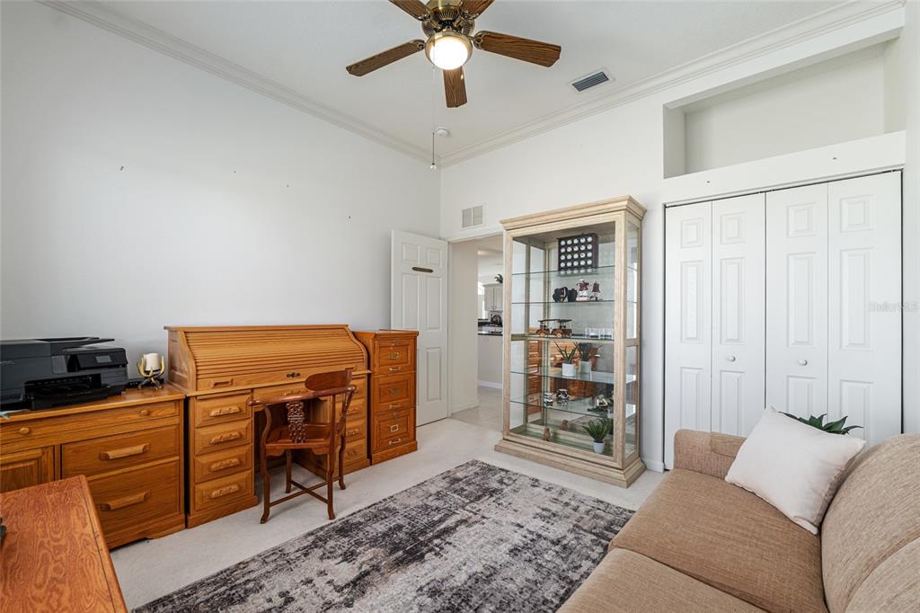 5711 Northwest 25th Loop Ocala, FL 34482 - Photo 53 of 91 a living room with furniture and a flat screen tv