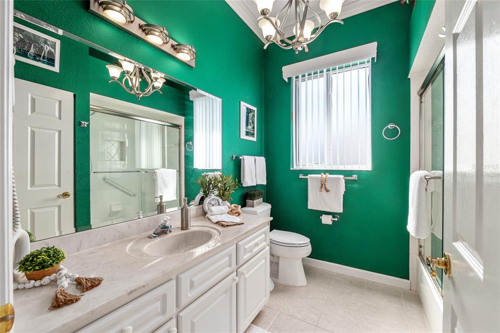 5711 Northwest 25th Loop Ocala, FL 34482 - Photo 55 of 91 a bathroom with a sink a toilet and shower