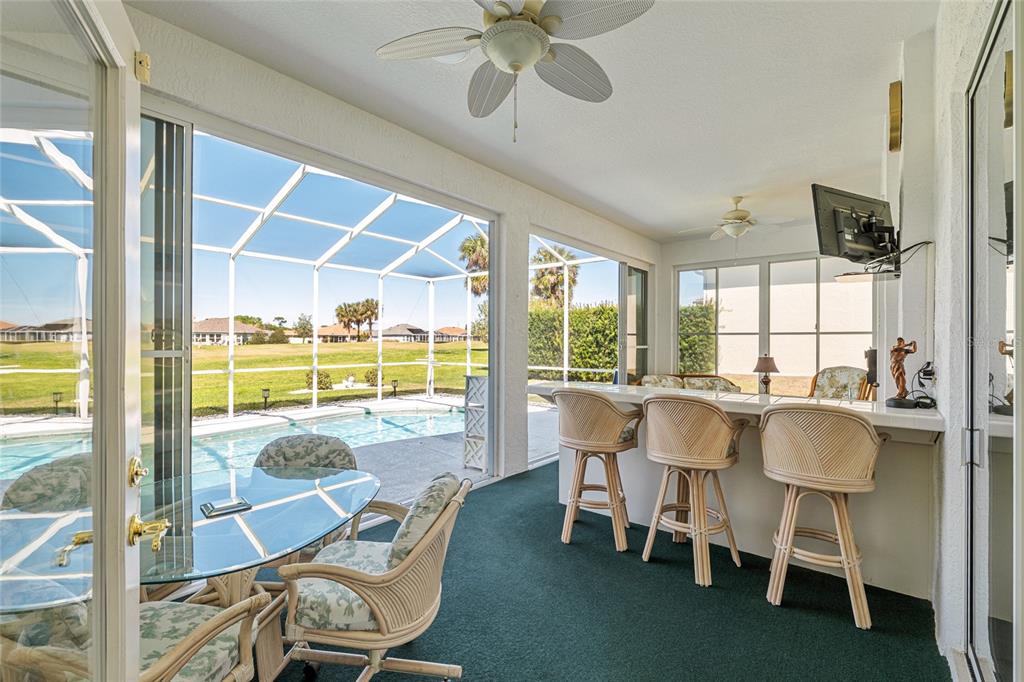 5711 Northwest 25th Loop Ocala, FL 34482 - Photo 60 of 91 a dining room with furniture a chandelier and large windows