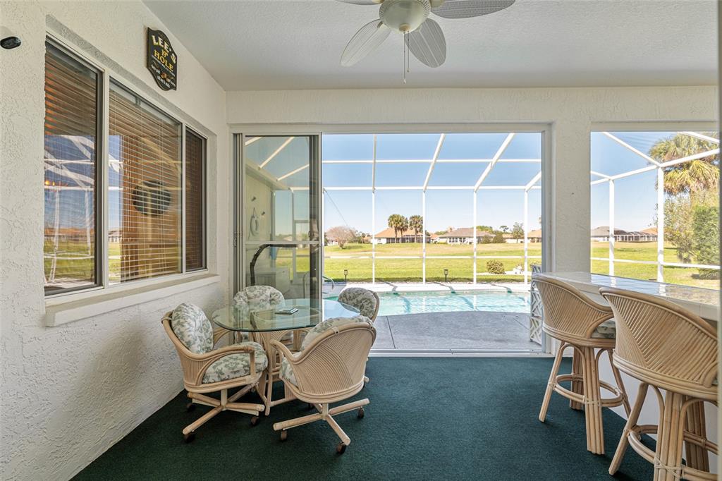 5711 Northwest 25th Loop Ocala, FL 34482 - Photo 61 of 91 a dining room with furniture and a floor to ceiling window