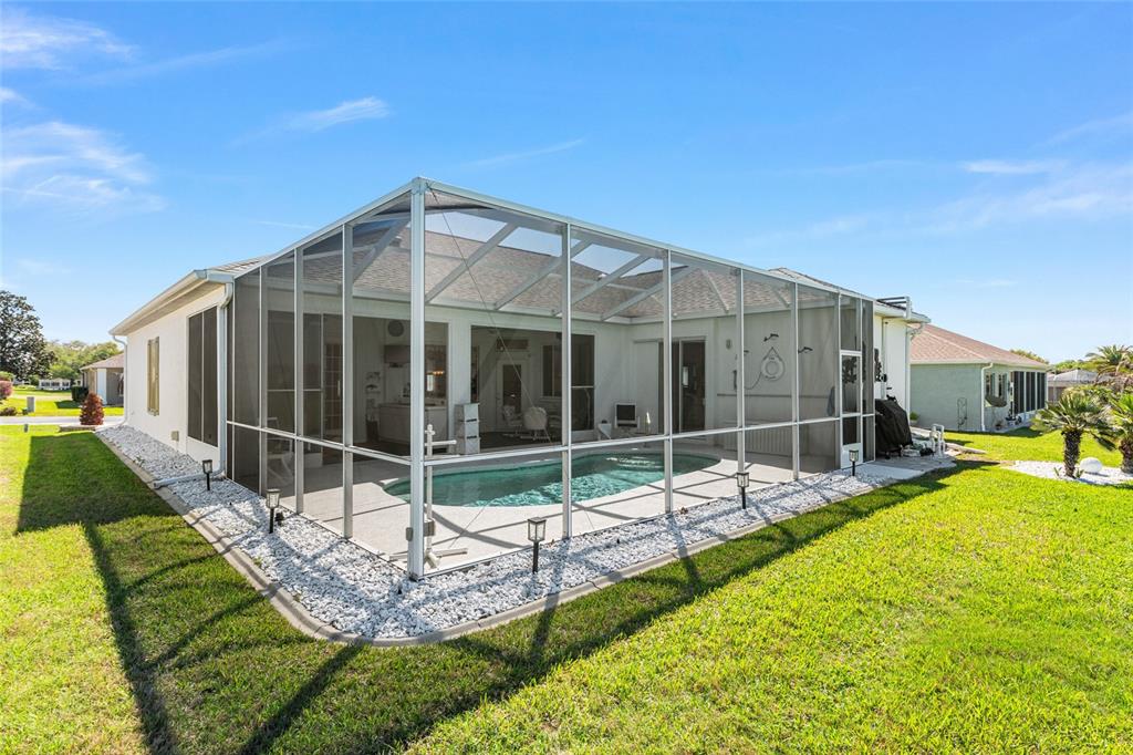 5711 Northwest 25th Loop Ocala, FL 34482 - Photo 76 of 91 a view of a house with backyard and sitting area