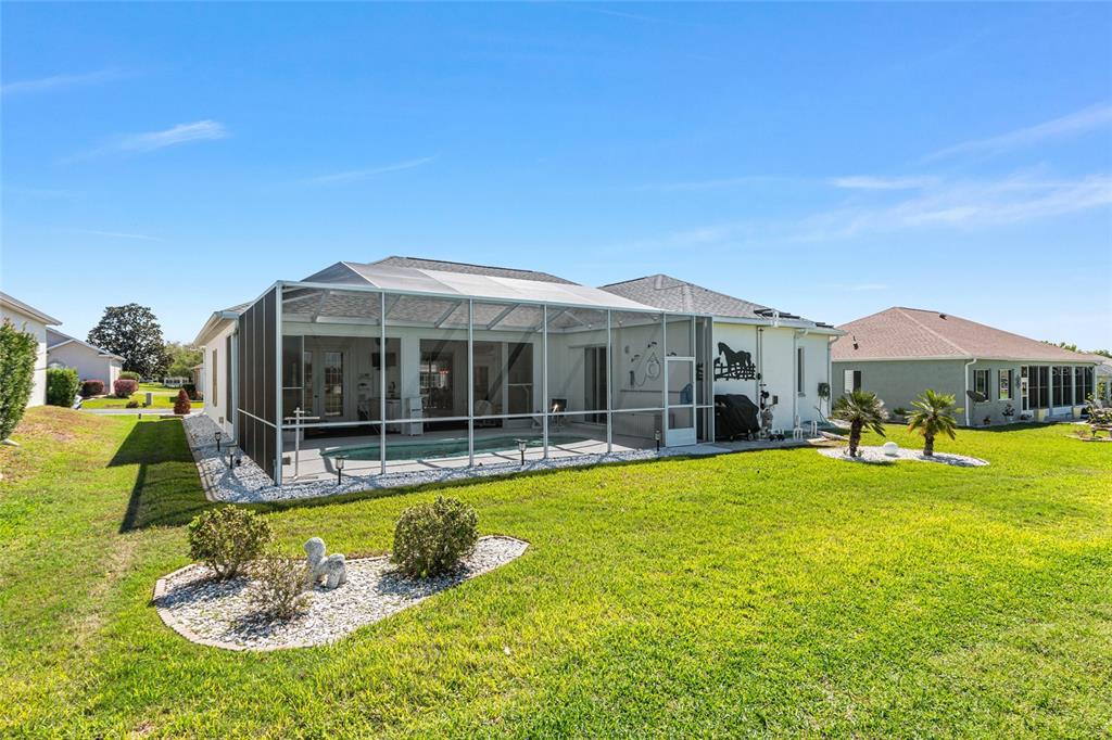 5711 Northwest 25th Loop Ocala, FL 34482 - Photo 78 of 91 a view of a house with swimming pool and a yard