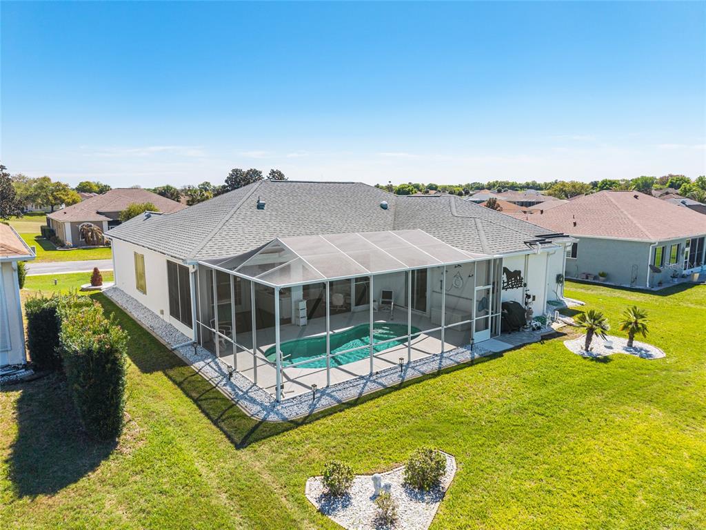 5711 Northwest 25th Loop Ocala, FL 34482 - Photo 80 of 91 an aerial view of a house with swimming pool garden and patio